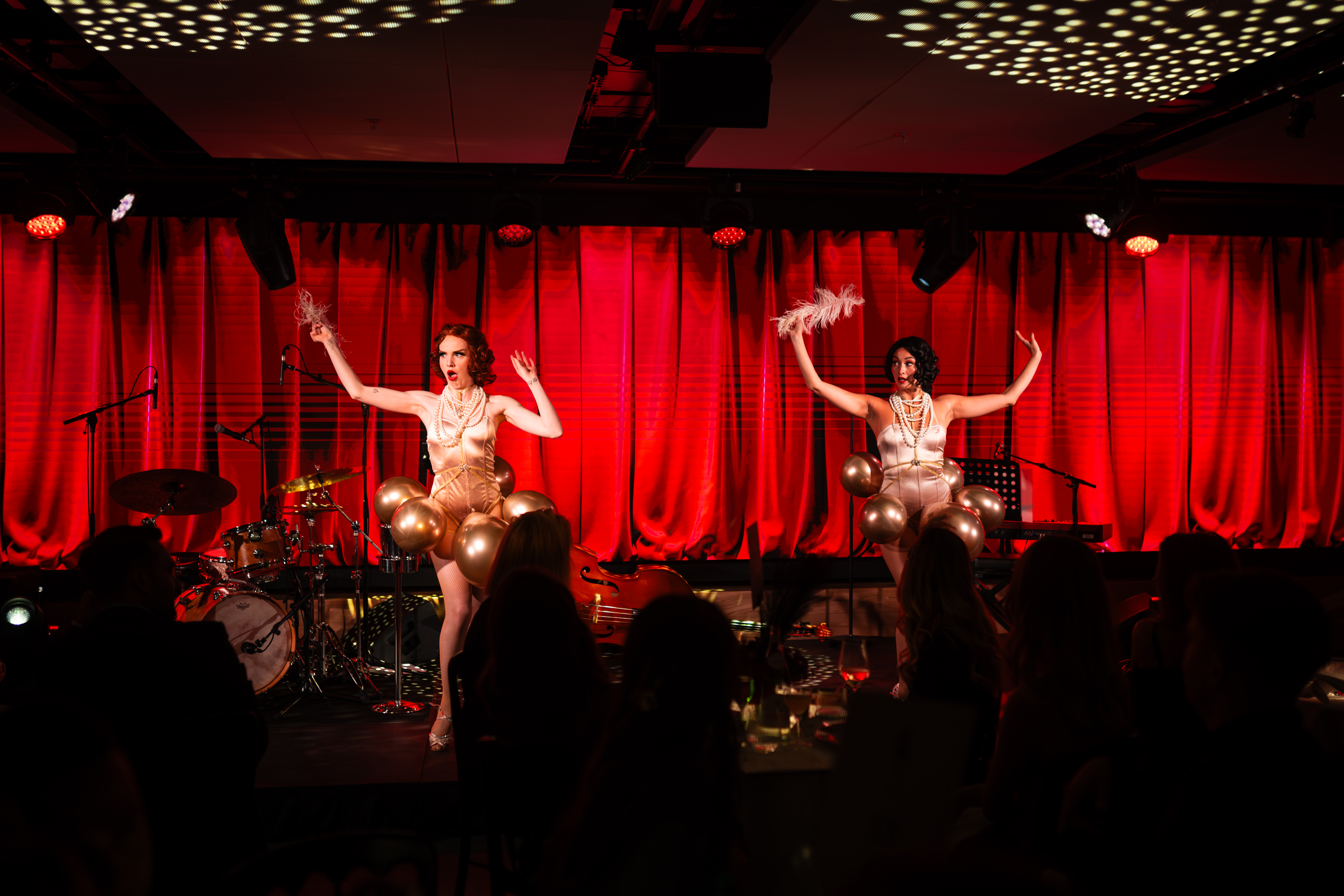 The cover image for the event: The Black Cat Cabaret is bringing an evening of spectacular variety, live music, and circus to Orange Box at Fulham Pier.