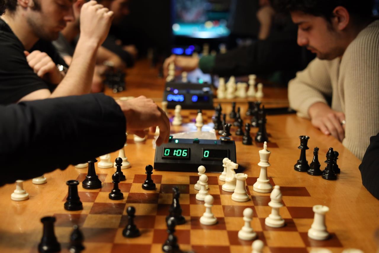 The cover image for the event: A high-intensity 5-minute blitz chess tournament at Fulham Pier, where top-rated players battle through group stages and knockouts for the title.