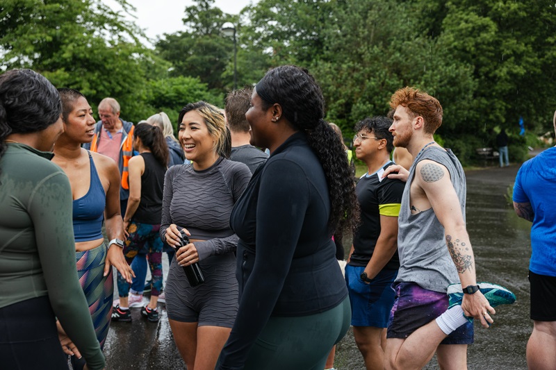 A group of people outdoors, tired after exercising